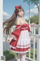 a woman in a red and white dress standing on a porch