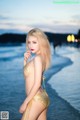 Atittaya Chaiyasing beauty poses hot on the beach with a yellow bikini (41 photos) P9 No.a36950