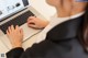 A woman sitting at a desk using a laptop computer.