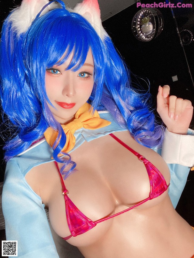 A woman in a bikini with blue hair and a cat ears.